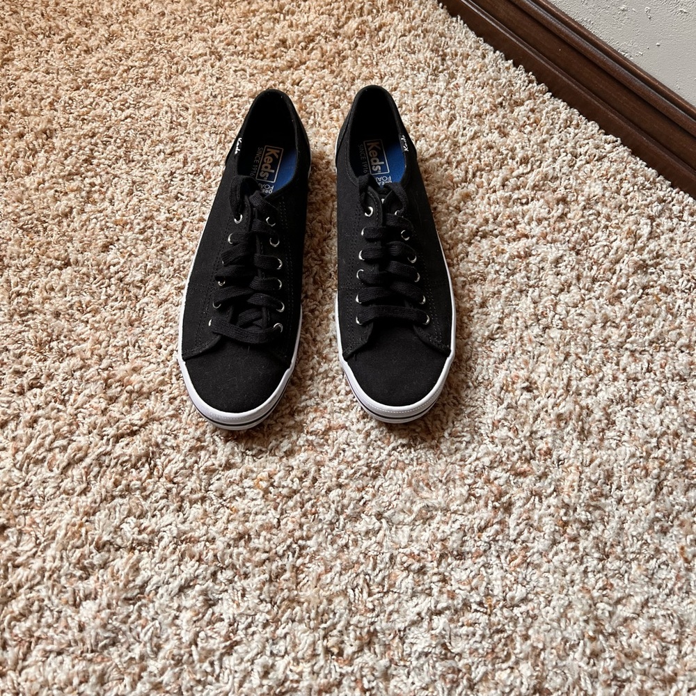 Woman’s Black Keds